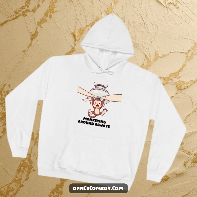 Funny hoodie featuring a monkey swinging from a ceiling fan blade, bringing playful jungle energy.