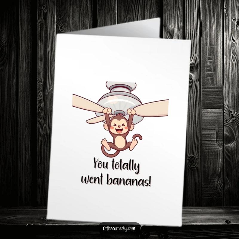 Funny free printable congratulations card showing a monkey swinging from a ceiling fan, celebrating success.