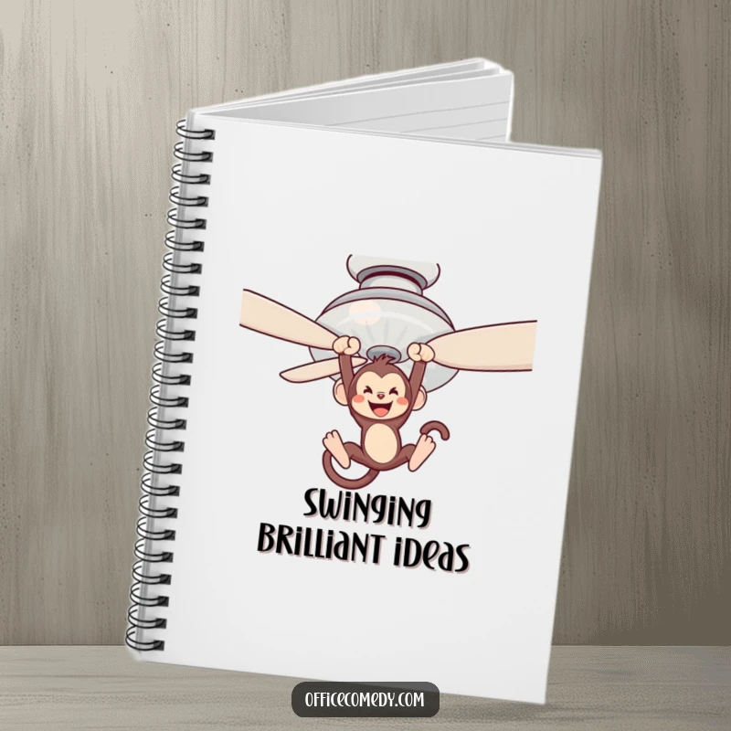Funny notebook with a monkey swinging from a ceiling fan blade, perfect for jotting down adventurous thoughts.