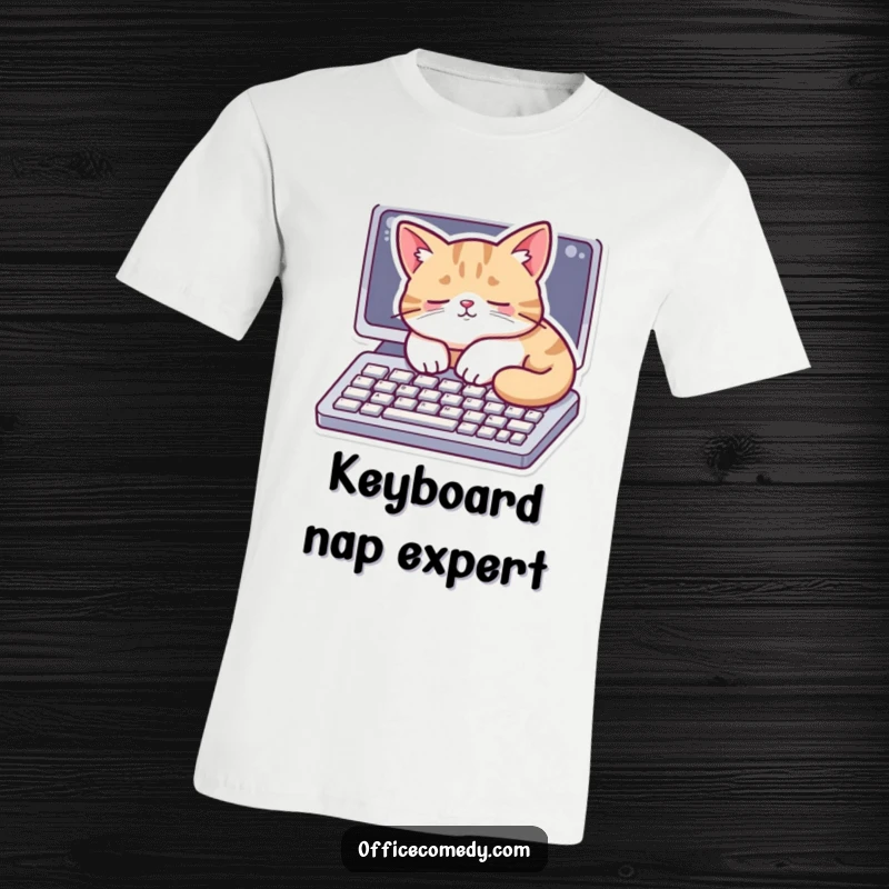 Funny t-shirt featuring a cat peacefully napping on a computer keyboard, embodying cozy tech life.